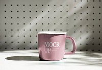 Pink mug mockup on a table