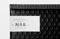 White shipping label mockup, black bubble mailer bag psd