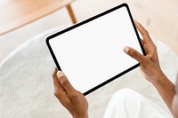 Digital tablet white screen mockup psd on a wooden table