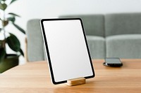 Digital tablet white screen mockup psd on a wooden table