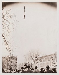 Untitled (Man Climbing a Flag Pole with Crowd Watching)