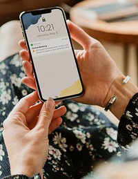 Woman holding smart phone