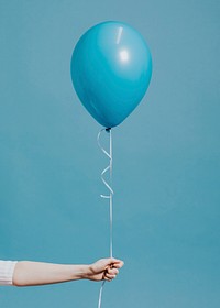 Girl holding blue balloon background