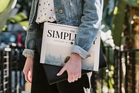 Woman standing with her latest newspaper