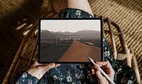 Woman blogging on a digital tablet mockup