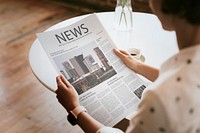 Woman reading a newspaper mockup