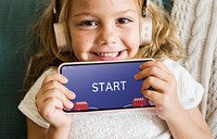 Little girl playing a mobile game