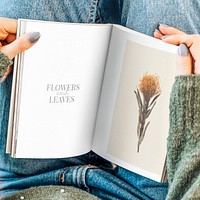 Woman reading a book mockup with flowers at home