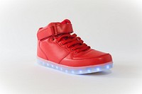 One red high top shoe with blue LED lights.