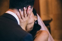 Newlywed couple kissing.