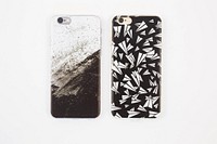 Black and white phone cases, grunge print and paper airplanes.