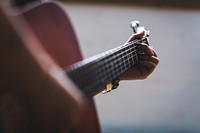 Playing acoustic guitar, musician.