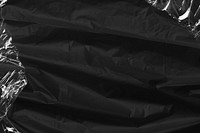 Black fabric texture background, plastic wrap border