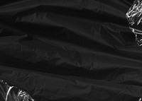 Black fabric texture background, plastic wrap border