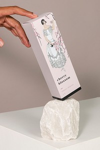 Paper box product psd mockup with woman with cherry blossom remix from vintage illustration published in Tr&egrave;s Parisien