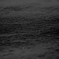 Aesthetic black sand textured background