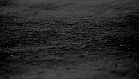 Abstract black sand textured background