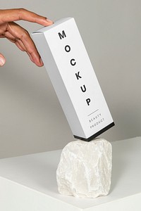 Cosmetic packaging on a white rock mockup