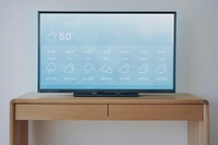 Smart TV screen mockup psd on a wooden table