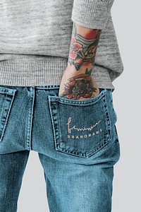 Tattooed woman with her hand in her jeans pocket mockup