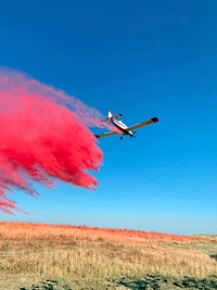 2022 BLM Fire Employee Photo Contest Category AviationA single engine airtanker drops retardant on the 2022 362 Fire, Vale District, BLM Oregon. Photo by Mitchell Ishida, BLM