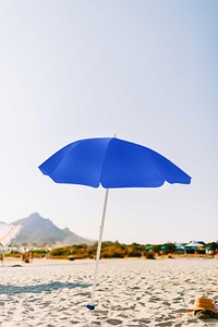 Blue sunshade on sunny beach