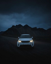 2019, Iceland, White Landrover driving in the countryside at night