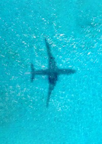 Plane shadow on ocean background