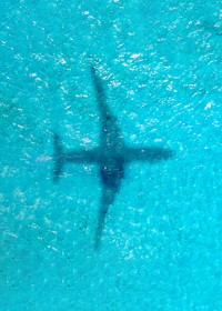 Plane shadow on ocean background