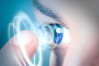 Man applying smart contact lens, biometric technology