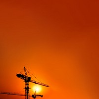 Construction crane, orange background