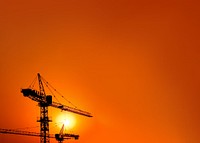 Construction crane, orange background