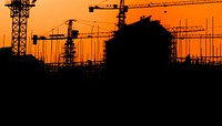 Construction silhouette, orange background