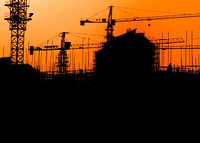 Construction silhouette, orange background