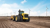 Tractor near wind farm