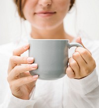 Woman with a coffee cup mockup