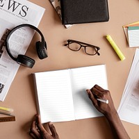 Black man writing on a notebook mockup