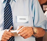 Businessman in a meeting holding a notebook and pen
