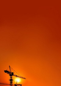 Construction crane, orange background