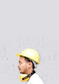 Man with safety helmet, yellow PPE