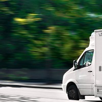 White delivery truck background, countryside drive