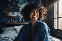 Happy black woman in bedroom