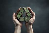 Hand recycling holding origami. 