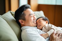 Baby cheerful newborn hugging. 