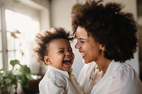 Laughing baby cheerful adult. 