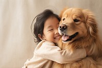 Toddler hugging Golden Retriever 