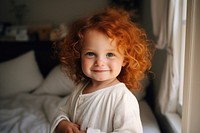 Happy little ginger-haired girl