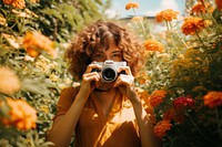 Woman with film camera in garden AI generated image