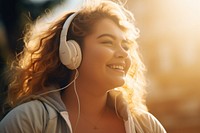 Woman listening to music, natural light