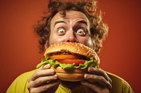 Man eating giant burger 